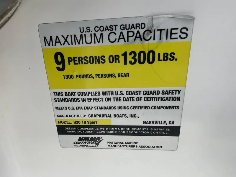 Slide: The Image of U.S. Coast Guard maximum capacities label for 2013 Chaparral 19 Sport H2O boat. - 19