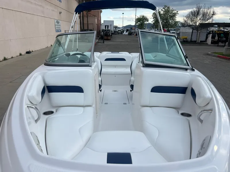 Slide: The Image of 2013 Chaparral 19 Sport H2O boat with white and blue interior. - 4