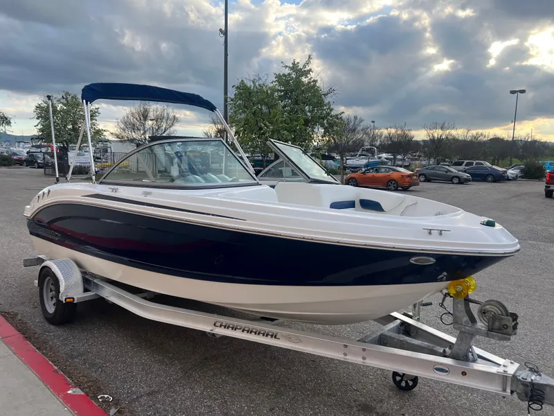 Slide: The Image of 2013 Chaparral 19 Sport H2O boat on a trailer in a parking lot. - 5