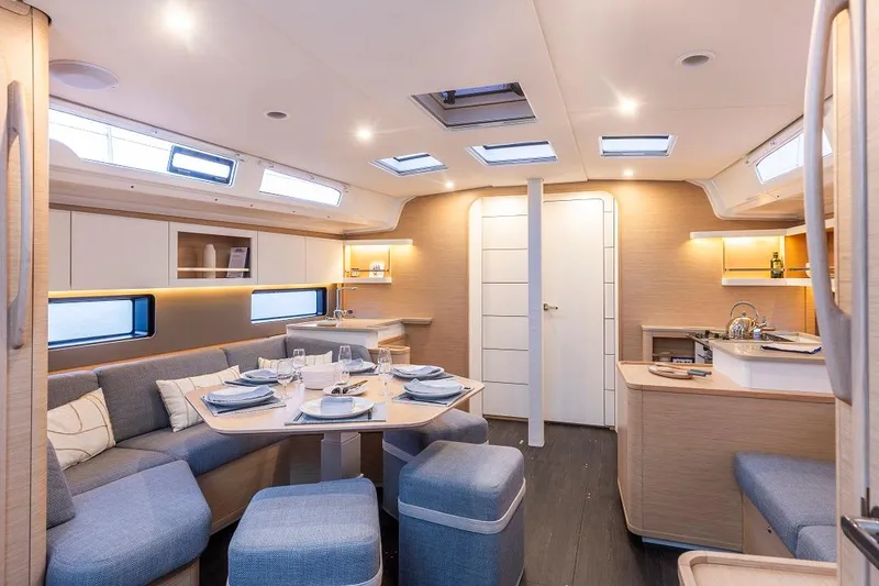 Slide: The Image of Modern interior of 2024 Dufour 44 yacht with dining area and kitchen. - 13