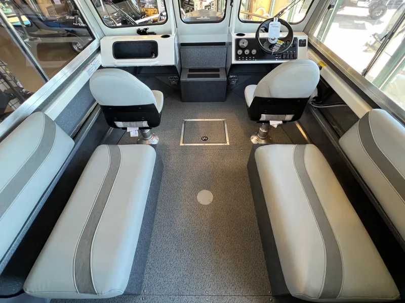 Slide: The Image of 2024 Spartan 185 Astoria boat interior with seating and steering console. - 13