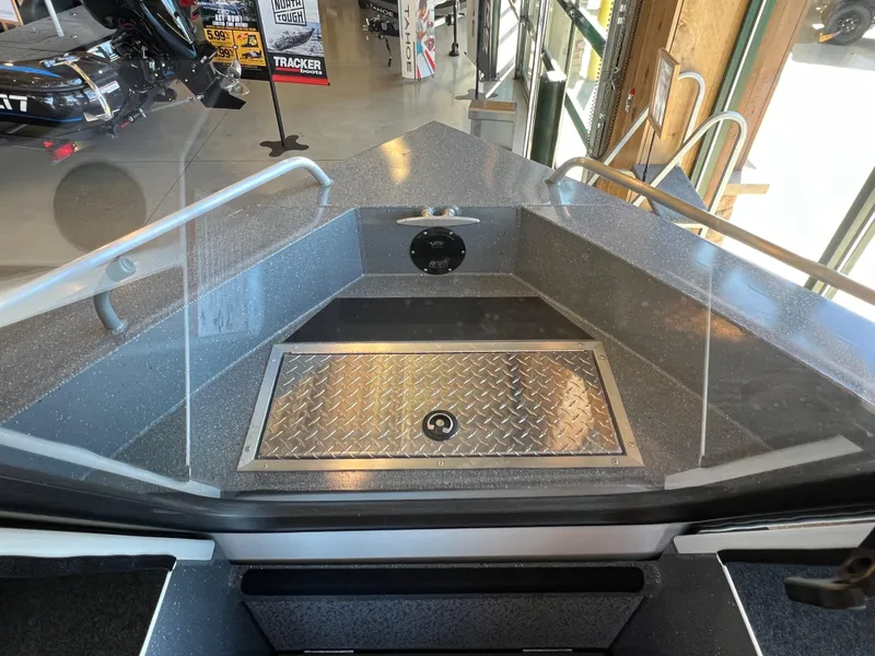 Slide: The Image of 2024 Spartan 185 Astoria boat interior with diamond plate storage compartment. - 16