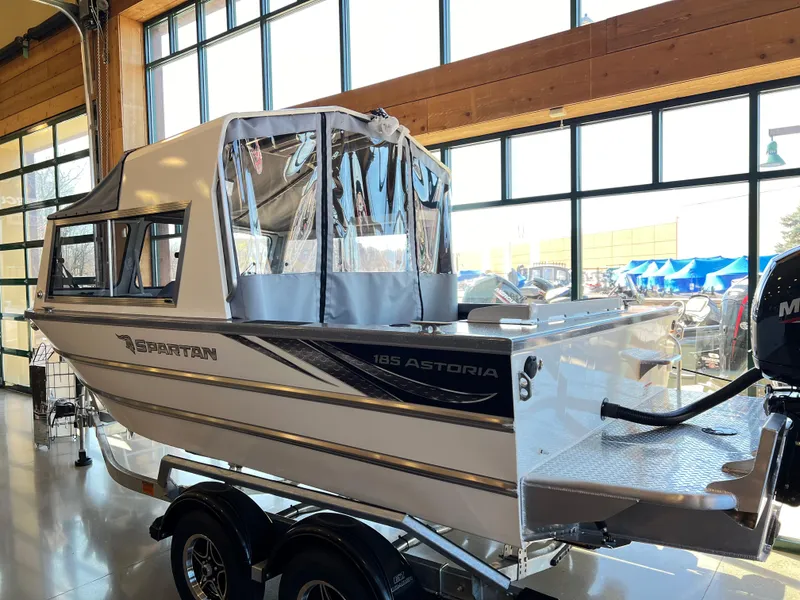 Slide: The Image of 2024 Spartan 185 Astoria boat on display in a showroom. - 3