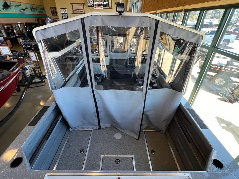 Slide: The Image of 2024 Spartan 185 Astoria boat interior with protective cover in showroom. - 6
