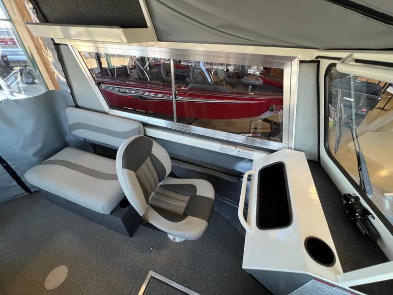 Slide: The Image of Interior of 2024 Spartan 185 Astoria boat with seating and control console. - 9
