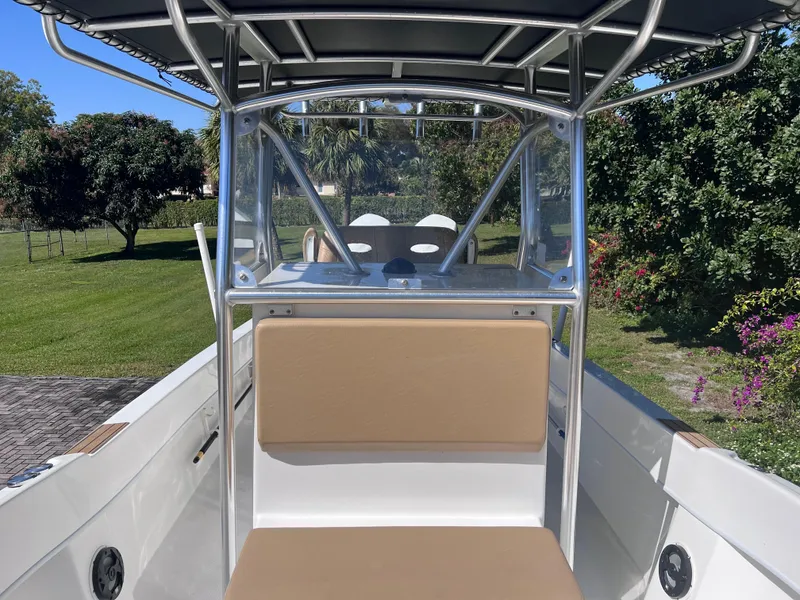Slide: The Image of 2022 Dusky 278 Center Console boat with tan seating and T-top. - 11