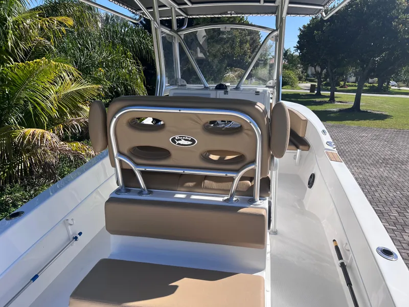 Slide: The Image of 2022 Dusky 278 Center Console boat with tan seating and stainless steel frame. - 15