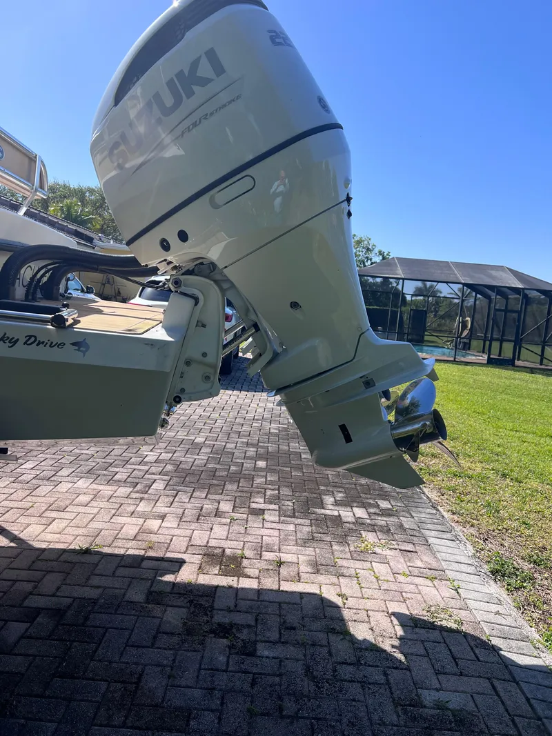 Slide: The Image of 2022 Dusky 278 Center Console boat with Suzuki outboard motor. - 7