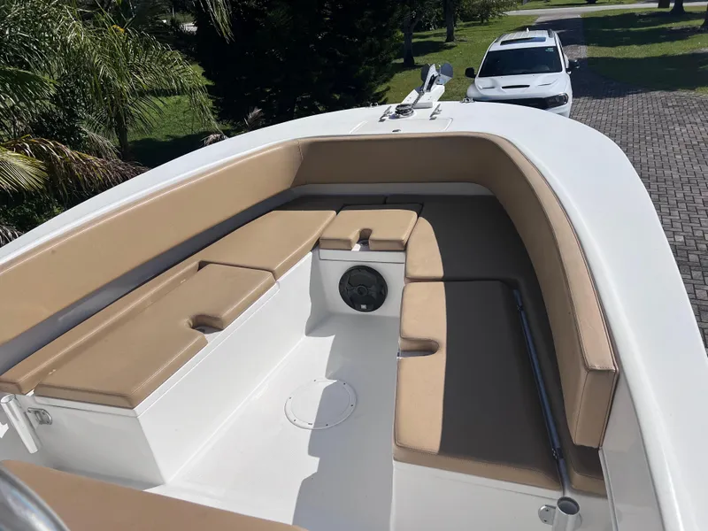 Slide: The Image of 2022 Dusky 278 Center Console boat with tan seating and white deck. - 8