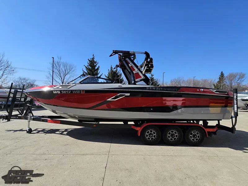 Slide: The Image of 2021 Centurion Ri265 boat on a trailer, red and black, side view. - 11