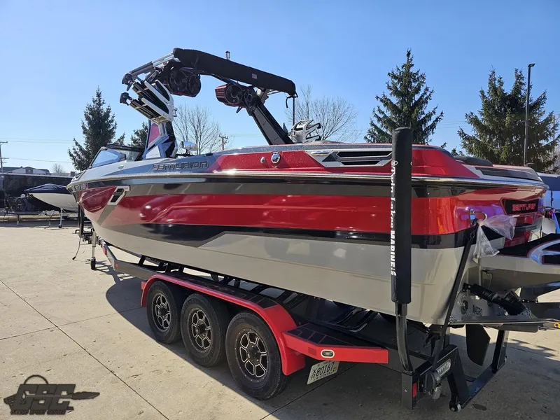 Slide: The Image of 2021 Centurion Ri265 boat on a trailer, red and gray color scheme. - 14