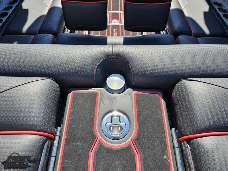 Slide: The Image of 2021 Centurion Ri265 boat interior with black and red upholstery and sleek design. - 23
