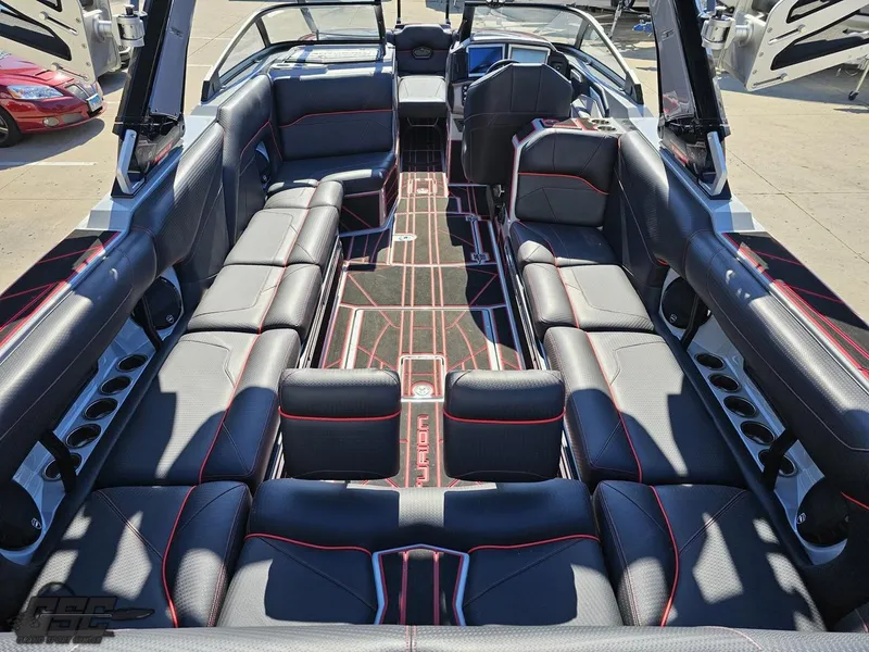 Slide: The Image of 2021 Centurion Ri265 boat interior with black and red seating. - 28