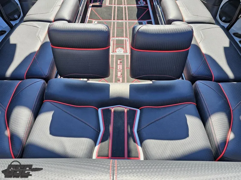Slide: The Image of 2021 Centurion Ri265 boat interior with black and red seating. - 29