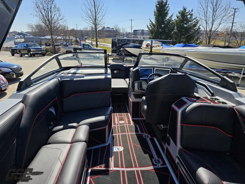 Slide: The Image of 2021 Centurion Ri265 boat interior with black and red seating. - 31