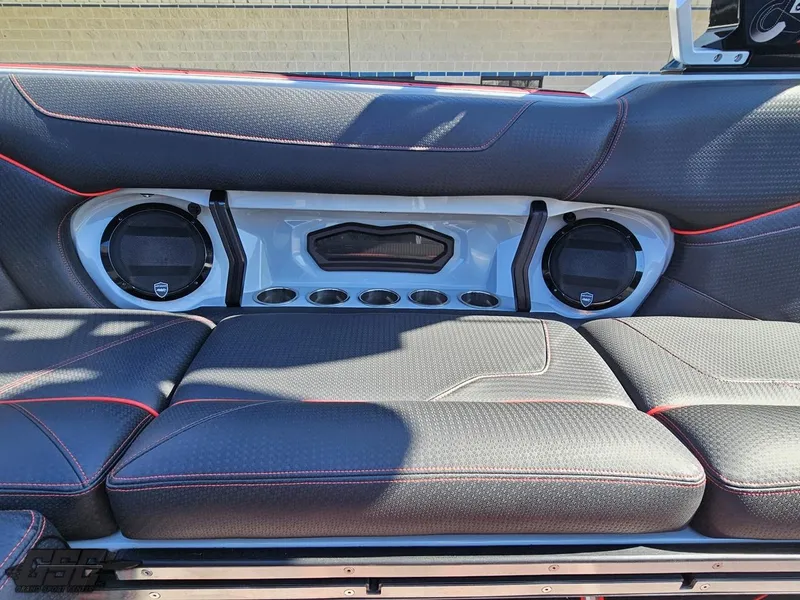 Slide: The Image of 2021 Centurion Ri265 boat interior with premium seating and built-in speakers. - 33