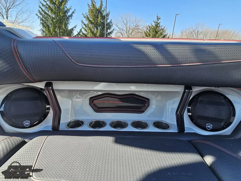 Slide: The Image of 2021 Centurion Ri265 boat interior with speakers and cup holders. - 34