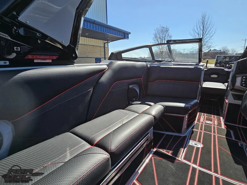 Slide: The Image of 2021 Centurion Ri265 boat interior with black and red seating. - 36