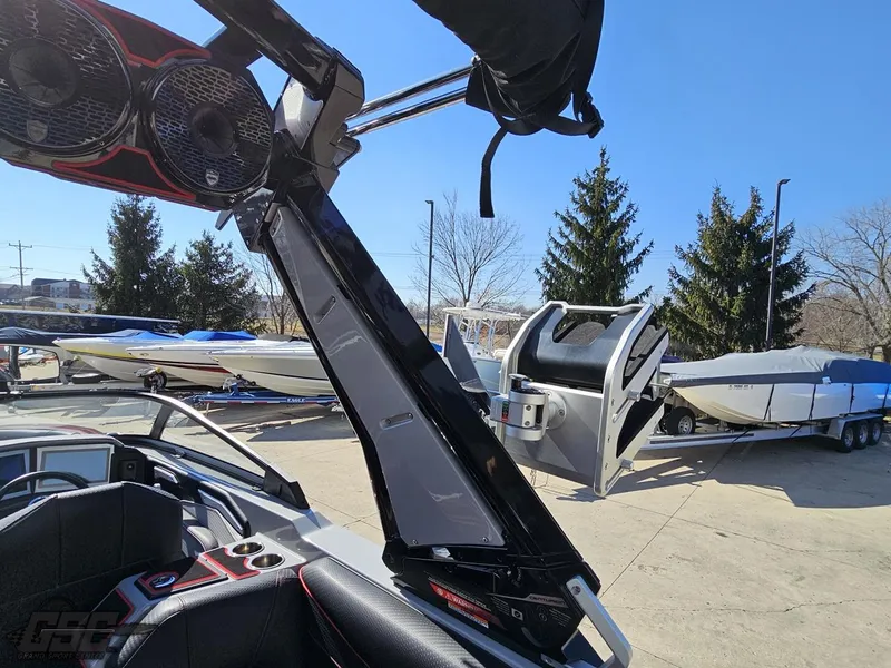 Slide: The Image of Centurion Ri265 2021 boat with advanced sound system and other boats in the background. - 40