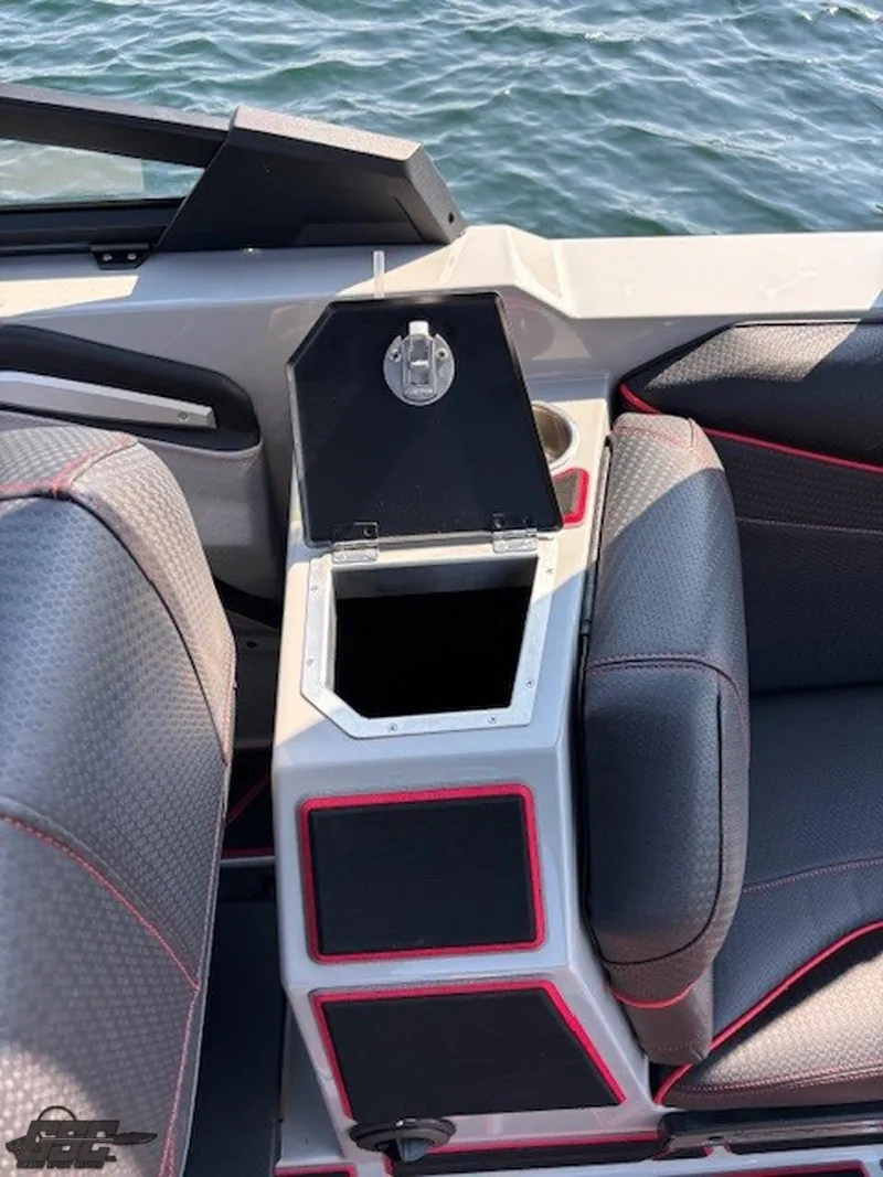 Slide: The Image of 2021 Centurion Ri265 boat interior with open storage compartment. - 43