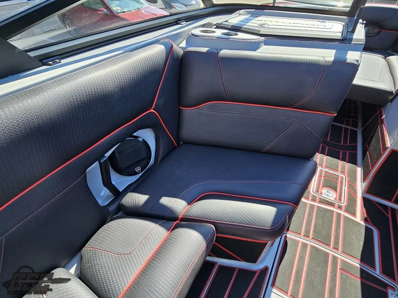 Slide: The Image of 2021 Centurion Ri265 boat interior with black and red seating. - 44