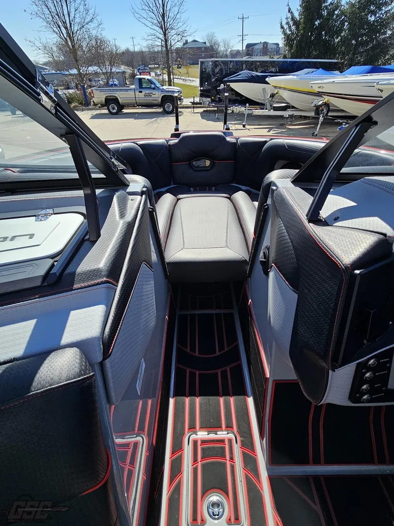 Slide: The Image of 2021 Centurion Ri265 boat interior with black and red seating. - 47