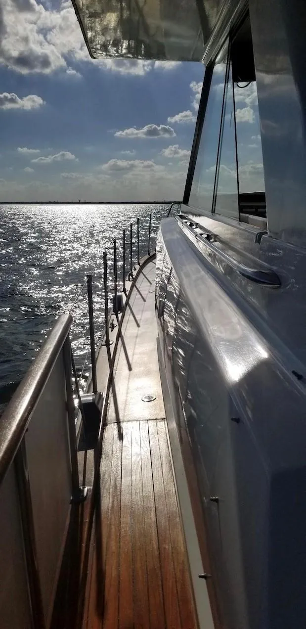 Slide: The Image of Side deck view of a 1969 Chris-Craft 46 Roamer yacht on a sunny day. - 12
