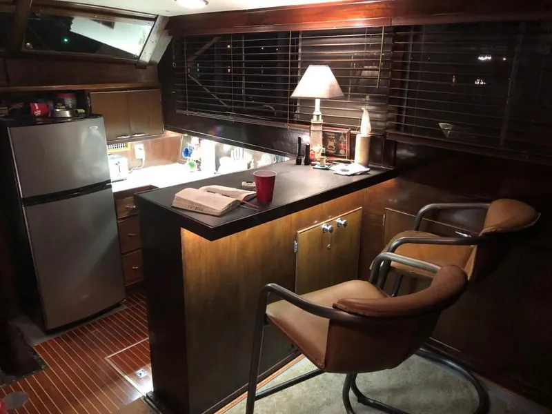 Slide: The Image of Interior of 1969 Chris-Craft 46 Roamer yacht with kitchen and bar area. - 2