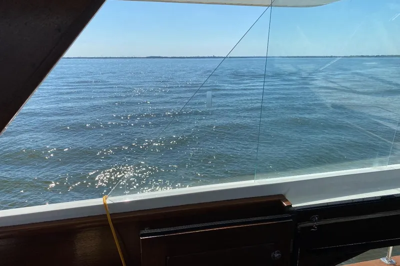 Slide: The Image of View from 1969 Chris-Craft 46 Roamer boat, looking out over calm waters. - 30