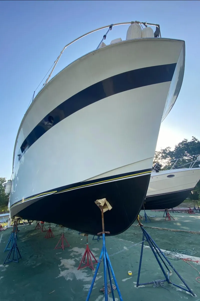 Slide: The Image of 1969 Chris-Craft 46 Roamer yacht on stands for maintenance. - 32