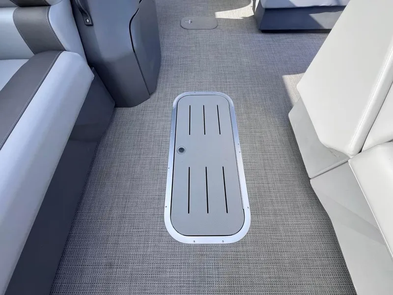 Slide: The Image of 2024 Bennington 22SVL-SPS boat interior with gray flooring and seating. - 13