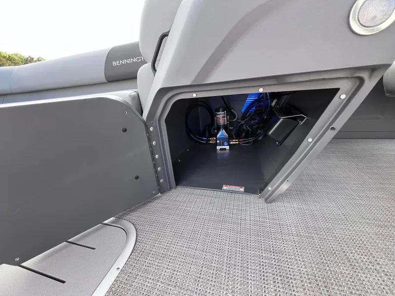 Slide: The Image of 2024 Bennington 22SVL-SPS boat storage compartment with wiring and equipment. - 17