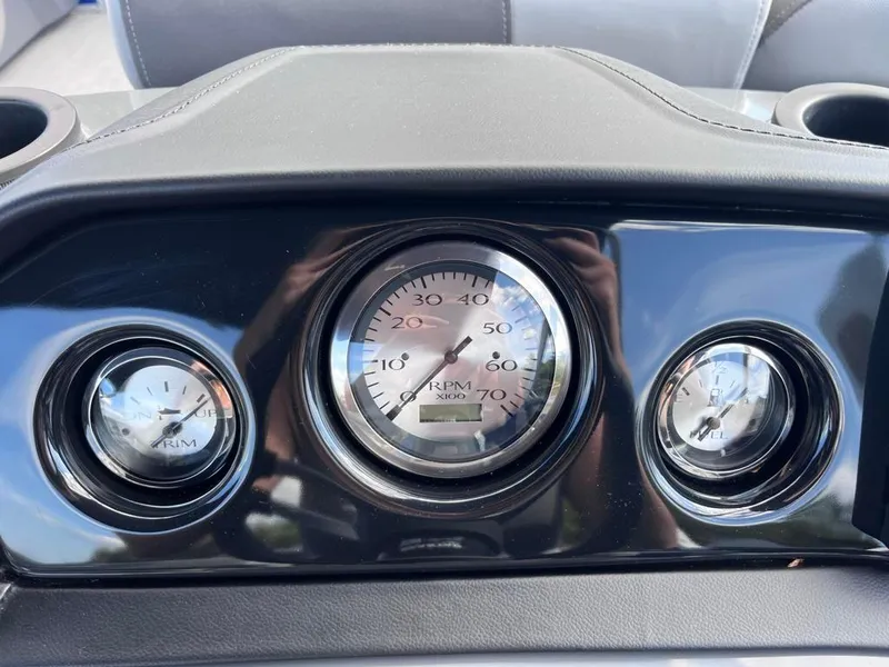Slide: The Image of Dashboard of 2024 Bennington 22SVL-SPS boat with RPM and fuel gauges. - 23