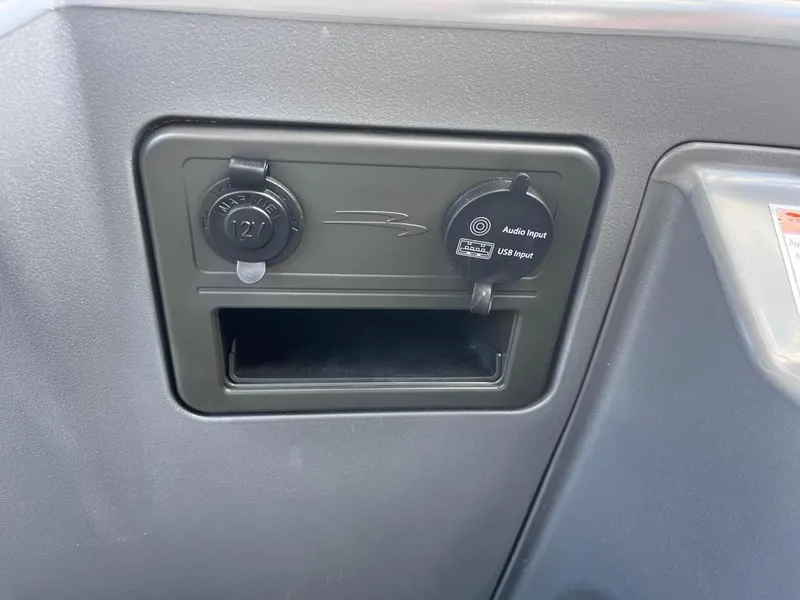 Slide: The Image of 2024 Bennington 22SVL-SPS dashboard with 12V and USB audio input ports. - 27