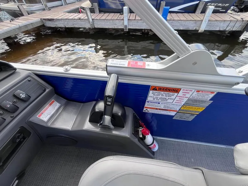 Slide: The Image of 2024 Bennington 22SVL-SPS boat interior with control panel and safety warnings. - 29