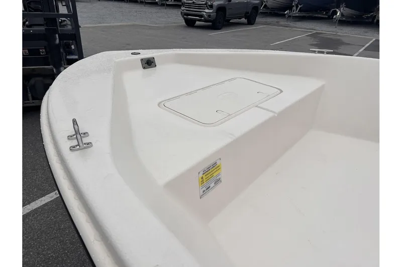 Slide: The Image of 2024 Carolina Skiff EV180 Sea Skiff bow deck with storage compartment. - 10