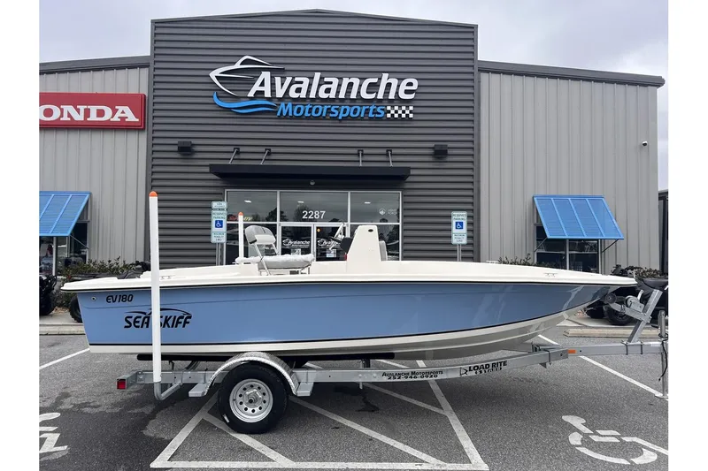 Slide: The Image of 2024 Carolina Skiff EV180 Sea Skiff boat on trailer at Avalanche Motorsports. - 2