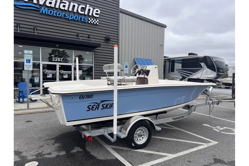 Slide: The Image of 2024 Carolina Skiff EV180 Sea Skiff boat on trailer at dealership. - 3
