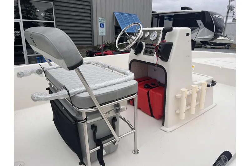 Slide: The Image of 2024 Carolina Skiff EV180 Sea Skiff boat interior with console and seating. - 5