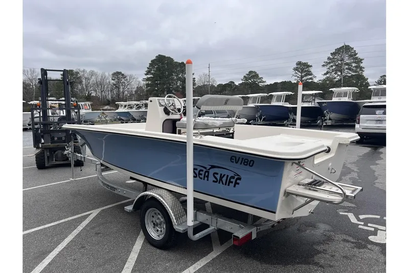 Slide: The Image of 2024 Carolina Skiff EV180 Sea Skiff on trailer in parking lot. - 7