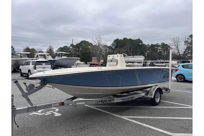 Slide: The Image of 2024 Carolina Skiff EV180 Sea Skiff on trailer in parking lot. - 8