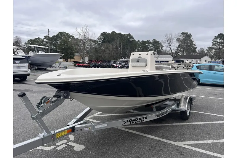 Slide: The Image of 2024 Carolina Skiff EV180 boat on Load Rite trailer in parking lot. - 8