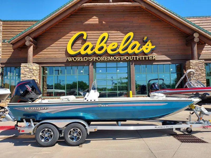 The Image of 2024 Ranger RB210 boat on trailer outside Cabela's store. - 0
