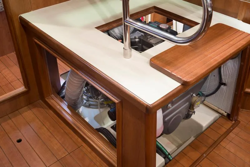 Slide: The Image of Engine compartment of a 2016 Marlow-Hunter 37 sailboat with wooden trim. - 12
