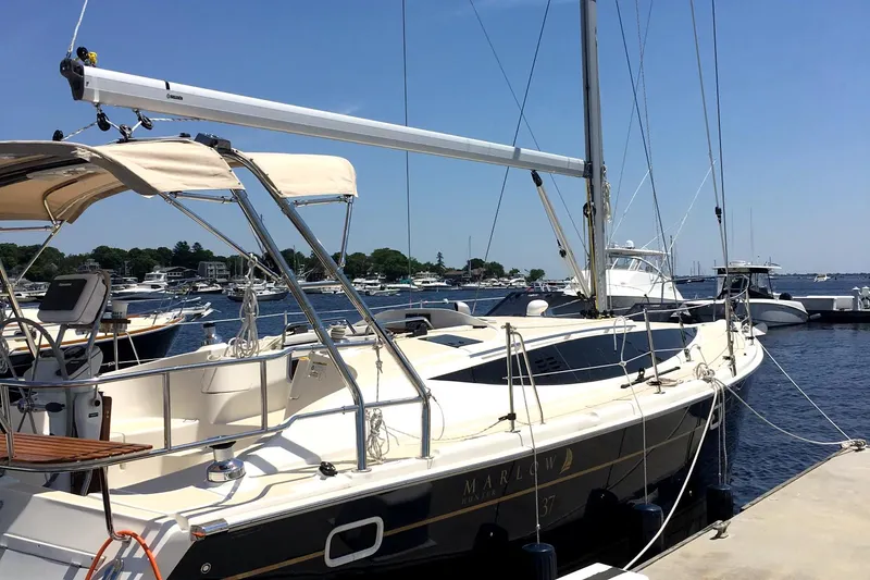 Slide: The Image of 2016 Marlow-Hunter 37 sailboat docked at a marina on a sunny day. - 20