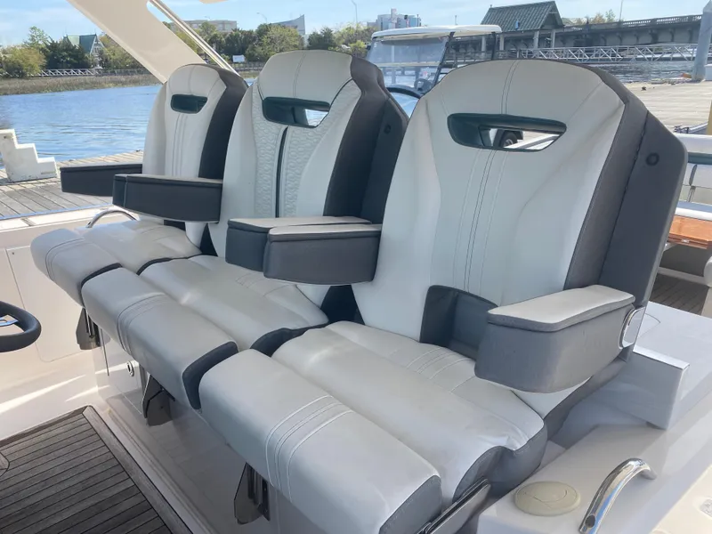 Slide: The Image of 2019 Tiara Sport 38 LS boat with luxurious seating at the helm. - 13