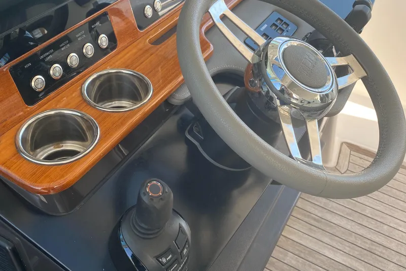 Slide: The Image of 2019 Tiara Sport 38 LS helm with steering wheel and controls. - 17