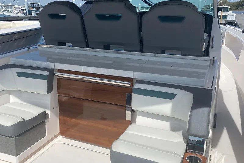 Slide: The Image of 2019 Tiara Sport 38 LS boat interior with seating and storage. - 19