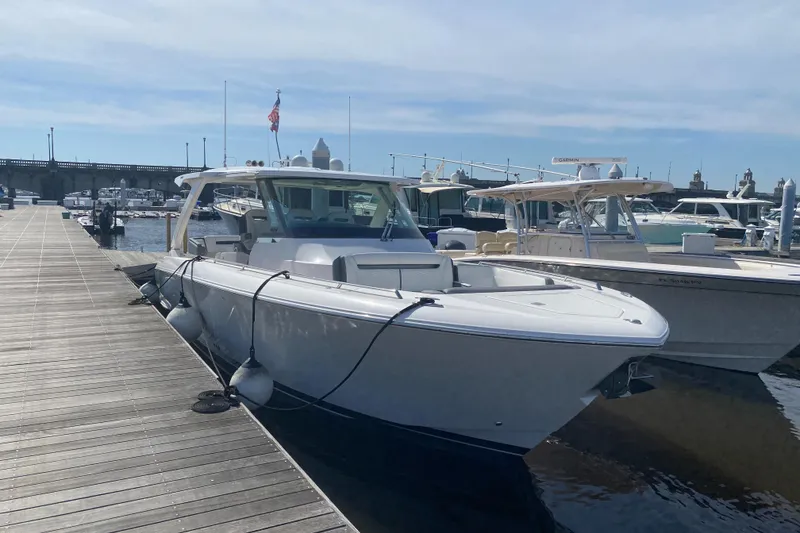 Slide: The Image of 2019 Tiara Sport 38 LS docked at a marina. - 2