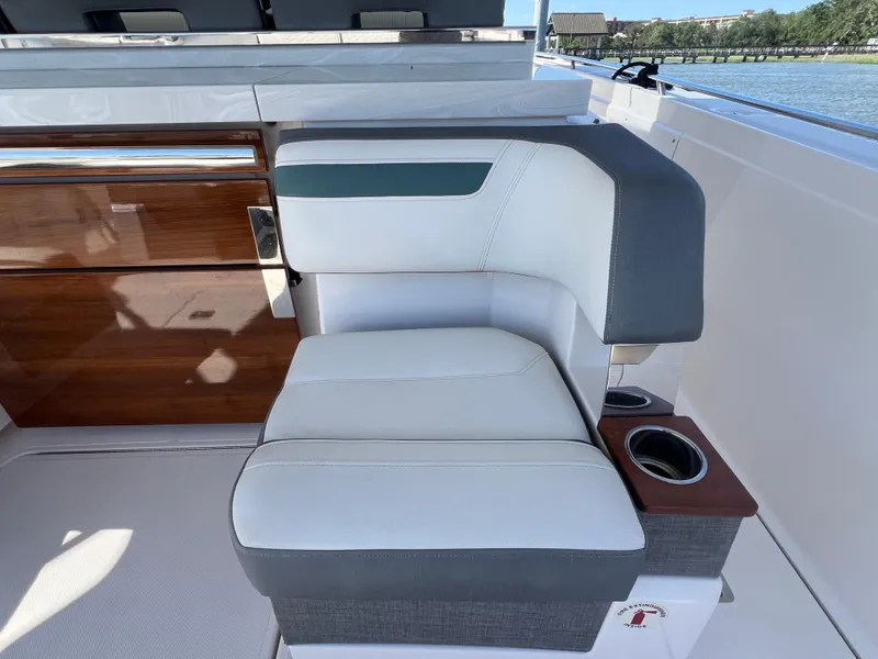 Slide: The Image of Luxurious seating on 2019 Tiara Sport 38 LS boat with cup holders and sleek design. - 24
